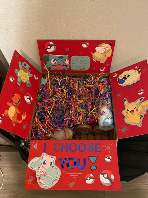 Pokemon Box Valentines Day, Pokemon Box Ideas, Custom Pokemon Cards Couple, Anime Gift Basket Ideas, Pokemon Box Diy, Pokemon Basket Ideas, Pokemon Care Package, Surprise Gift Box Diy, Diy Pokemon Valentines Boxes