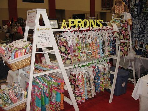 great craft booth displays - Bing Images Clothing Rack Display Market, Apron Display, Upcycle Ladder, Craft Booths, Ladder Display, Lucky Ducky, Craft Show Booths, Craft Show Booth, Clothing Display