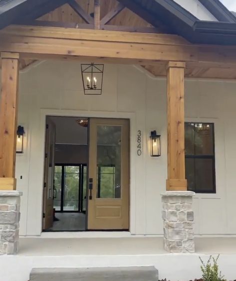 Open Gable Front Porch Lighting, Big Front Porch Ideas Modern, Painted Pillars Front Porches, Beams On Front Porch, Modern Farmhouse Front Porch Lighting, Outdoor Pole Wrap Ideas, Exterior Chandelier Front Porches, Front Entrance Ideas Exterior Modern, Wood Pillars Front Porch