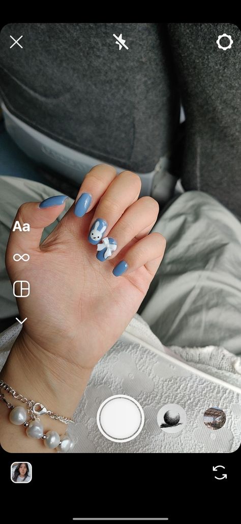 square tip nail design with blue background. there is a white miffy bunny design on the middle finger, and a white ribbon charm on the ring finger. Nail Inspo, Gel Nails, Ribbon, Nail Art, Nails, Blue