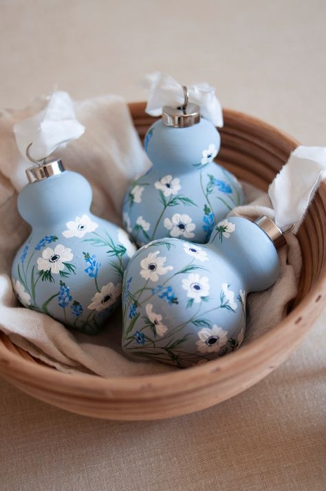 "A hand-painted retro finial ceramic ornament in dusty blue with white anemones and blue muscaris. Come with a silver cap and silk ribbon. Due to the hand-painted nature, no two ornaments will be identical. The preorder for this current lot will be shipped in the beginning of November. Ornament size: 4 ½\" H x 2 ⅞\" Dia." Hand Painted Ornaments Glass Ball, Handpainted Christmas Ornaments, Ceramic Christmas Decorations, Hosting Christmas, Fun Ornaments, Easter Egg Crafts, Blue Tree, Egg Crafts, Painted Ornaments