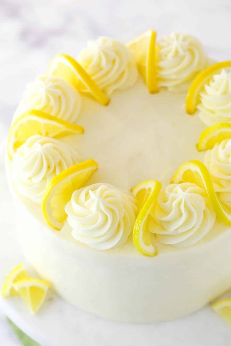 This lemon layer cake is bursting with real lemon flavor. Fresh lemon juice is baked into three layers of fluffy vanilla cake that are filled and frosted with vibrant lemon cream cheese frosting. Homemade Lemon Cake Recipe, Best Lemon Cake Recipe, Lemon Birthday Cakes, Homemade Lemon Cake, Lemon Layer Cake, Lemon Curd Cake, Lemon Layer Cakes, Lemon Cream Cheese Frosting, Lemon Cream Cheese