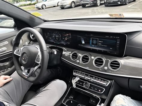 Man behind the wheel of a Mercedes Benz AMG E43. E43 Amg, Canada Photography, Benz S, Benz E, Benz E Class, Infotainment System, Twin Turbo, Car Photos, Mercedes Amg