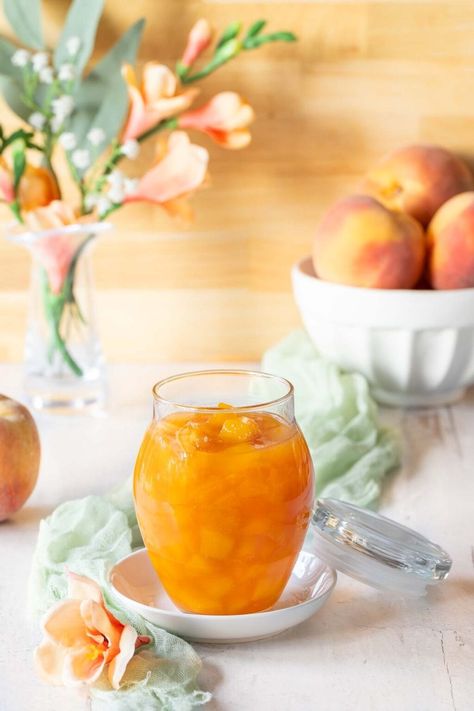 This easy-to-make peach sauce is the perfect way to capture the essence of summer. Made with fresh, ripe peaches and a few simple ingredients, it's a versatile topping for everything from pancakes and waffles to grilled chicken and pork chops. Try it on ice cream, cheesecake, or even create a yogurt, peach, and granola parfait! #seasonedkitchen #howtomakepeachsauce #peachcompoterecipe #summerrecipes #easypeachrecipes #easysaucerecipes Peach Sauce For Cheesecake, Sauce For Cheesecake, Ice Cream Cheesecake, Peach Compote, Peach Sauce, Granola Parfait, Cream Cheesecake, Thanksgiving Cooking, Fruit Jam