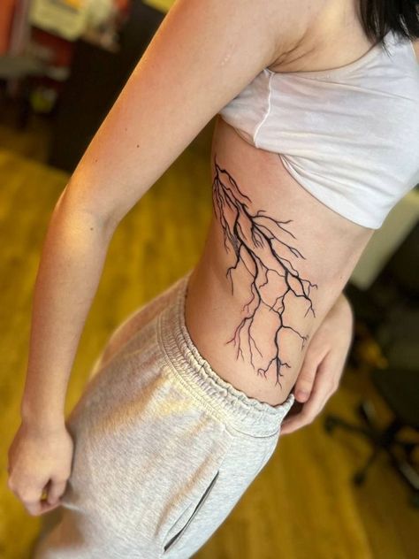 Lightning Tattoo On Ribs, Lightning Rib Tattoo, Lightning Tattoo Women, Lightning Tattoos, Storm Tattoo, Lightning Tattoo, Bolt Tattoo, Cowgirl Tattoos, Tattoos To Cover Scars