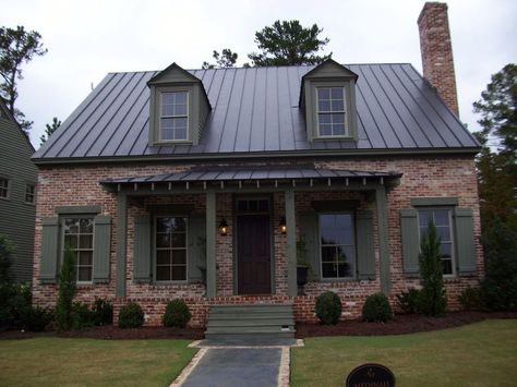 brick house with metal roof - Google Search                                                                                                                                                                                 More                                                                                                                                                                                 More Outdoor Paint Colors, Black Metal Roof, Metal Roof Houses, Cedar Shutters, Green Shutters, Houses Architecture, Brown Roof, Brown Brick, House Trim