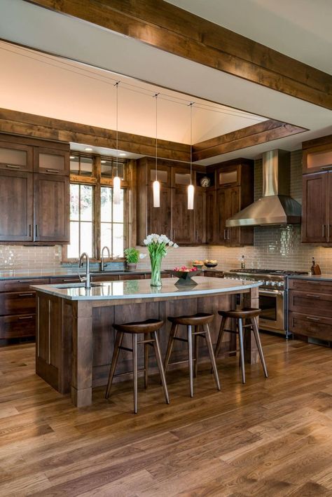 Are you tired of your brown kitchen cabinets? Do they feel outdated or past their prime? You aren’t alone. Brown cabinets were extremely popular in traditional kitchen designs throughout the 1900’s. Now, in the 21st century, many are wondering if brown kitchen cabinets are out of style. Homeowners are ready to ditch their chocolate-toned kitchens in favor of more modern color schemes. But is this hasty decision? Are brown cabinets in fact out of style? Brown Kitchen Cabinets, Rustic Kitchen Island, Rustic Kitchen Cabinets, Traditional Kitchen Design, Farmhouse Kitchen Island, Wood Kitchen Island, Staining Cabinets, Brown Cabinets, Tuscan Design