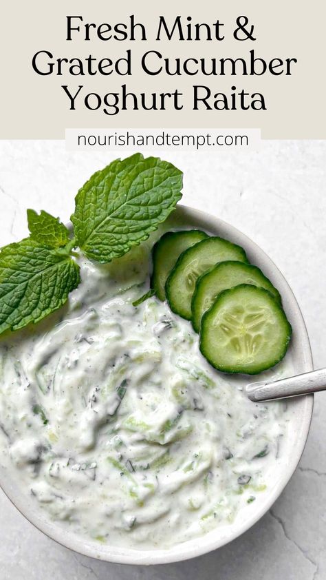 A bowl of raita topped with cucumber slices and a fresh mint sprig Indian Cucumber Raita, Cucumber Raita Recipe Indian, Raita Recipe Indian, Cucumber Raita Recipe, Healthy Dressings, Mint Raita, Cucumber Yogurt Sauce, Raita Recipe, Cucumber Raita