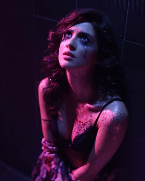 Laura Marano in glitter makeup and dark purple lighting Messy Makeup Photoshoot, Single Tear Aesthetic, Cry Photoshoot Poses, Glitter Dark Makeup, Dark Emotional Photoshoot, Glitter Tears Photoshoot, Dark Clubbing Aesthetic, Dark Lighting Photoshoot, Glitter Tears Aesthetic