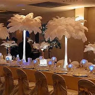 How to Create Floral Arrangements With Eiffel Tower Vases | eHow Feather Centerpieces Diy, Non Flower Centerpieces, Candelabra Wedding Centerpieces, Ostrich Feather Centerpieces, Candelabra Wedding, Eiffel Tower Vases, Tower Vase, Feather Lamp, Feather Centerpieces