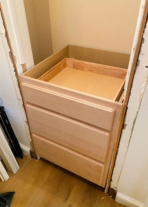 This Monochrome Entryway Built-In Is Actually a Kitchen Cabinet Tiny Entry Closet Makeover, Entryway Closet Removal, Hall Closet With Drawers, Tiny Hall Closet Ideas, Coat Closet In Living Room, Coat Closet With Drawers, Foyer Closet Makeover Entrance, Entryway Ideas With Closet, Built In Entryway Closet