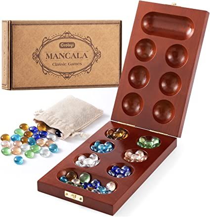 Amazon.com: Crobyi Mancala Board Game Set for Kids & Adults, Includes Portable Folding Rubber Wood Board, 48+5 Glass Stones, Stones Storage Bag & Mancala Instructions. Classic Marble Board Game for Family. : Toys & Games Marble Board Game, Mancala Board, Marble Board, Classic Games, Wood Board, Rubber Wood, Storage Bag, Board Games, Bag Storage