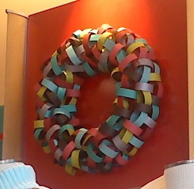 Paper loops hot glued to a cardboard wreath form. Thanks for the idea, Gymboree! Cardboard Wreath, Cardboard Wreath Form, Red Things, Wreath Forms, Holiday Time, Wreath, Packaging, Holidays, Building