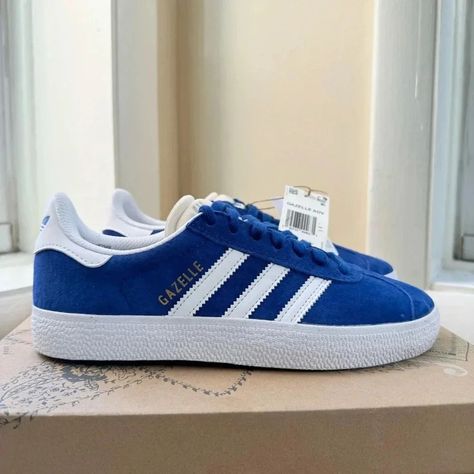 Adidas Gazelle Sneakers Women's Royal Blue New With Tags Without Box Women's Size 6.5 Suede Colorway: Royal Blue / Cloud White / Cloud White Blue And White With Gold Gazelle Letters Style #Gw3194 Release Date: March 21, 2022 Lace-Up A Pair Of Adidas Gazelles And Feel The Vintage Vibes. Bringing Back The 1991 Form, This Reissue Offers The Signature Suede Upper In Versatile Colors. Contrasting Details Pop Against The Sleek Silhouette And Tie-In The Rubber Sole For A Cohesive Effortless Style. What Adidas Gazelles, Letters Style, Nike Shoes Jordans, White Cloud, Blue Clouds, Adidas Gazelle Sneaker, Cloud White, March 21, Shoes Adidas