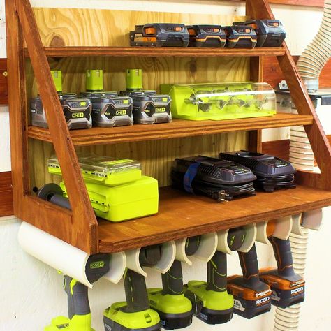 Here is a simple custom storage solution for some of your cordless drills, batteries, and chargers. It was built with 3/4" plywood and pvc pipe. Pvc Cordless Tool Storage, Drill Battery Storage, Drill And Battery Storage, Battery Tools Storage, Diy Drill Charging Station, Cordless Tool Storage, Arbejdsplads Garage, Drill Charging Station, Battery Charger Station