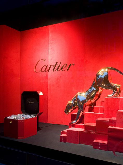 What's the saying ... diamonds are a panther's best friend?! For this luxurious window display, we created a fibre glass sculpted panther making quiet movements towards a red chest of sparling diamonds - #windowdisplay #retaildesign #cartier #visualinspiration #highstreet #luxury Luxury Window Display, Cartier Panther, Attention Getters, Clothing Store Interior, Jewelry Store Design, Store Design Boutique, Visual Merchandising Displays, Window Display Design, Christmas Window Display