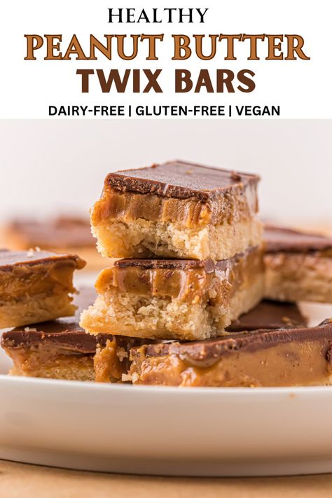 Healthy peanut butter Twix bars on a plate. Text on image for Pinterest shading. Twix Bars Gluten Free, Almond Flour Twix Bars, Healthy Twix Bars Almond Flour, Peanut Butter Twix Bars, Twix Cups, Gluten Free Twix Bars, Raw Twix Bars, Healthy Twix Bars, Dairy Free Dessert Recipes Easy