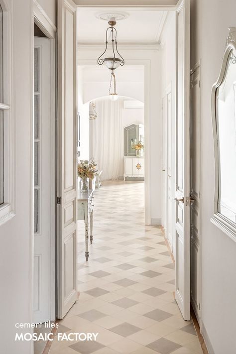 This checkerboard design makes this hallway featuring our monocolour encaustic tiles the most inviting space to explore the rest of this stunning project by (IG)pelusastudio. Elegant and timeless, full of warm character, the cement tiles here are our UNI model size 20x20 cm in colours LC and LM. All our cement tile designs can be customised in bespoke colours directly online. Visit our website and find this design in stock! Hall Floor Tile Design, Cement Tiles Kitchen, Tiled Hallway Floor, Terrazzo Tile Floor, Hallway Tiles Floor, Cement Tile Floor, Hall Flooring, Tiled Hallway, Hallway Flooring