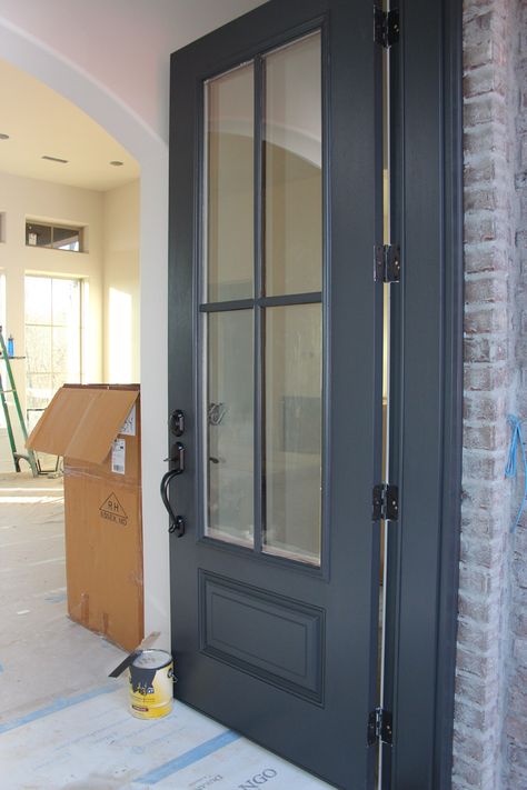 Door color is painted with Wrought Iron from Benjamin Moore. Gray in the base keeps the black from being too harsh. Door And Trim Colors, Benjamin Moore Wrought Iron, Porte In Ferro, Dark Doors, Trim Colors, Door Paint Colors, Casa Exterior, Front Door Colors, Exterior Paint Colors