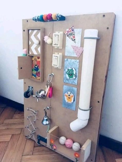 Preschool Busy Board, Busy Wall For Toddlers Diy, Diy Baby Sensory Board, How To Make A Busy Board, Montessori Activity Board, Activity Board For Babies, Outdoor Sensory Board, Busy Boards For Babies, Sensory Boards Diy