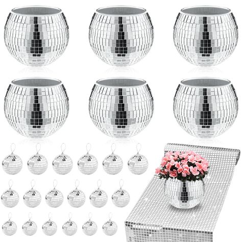 PRICES MAY VARY. Complete Elegance Ensemble：Unveil a world of sophistication with our comprehensive set, meticulously curated to elevate the ambiance of weddings, events, and your living spaces. The 6-piece disco ball decor, accompanied by a delightful assortment of 18 mini disco balls and disco party tablecloth, promise to transform any setting into a realm of enchantment Irresistible Visual Allure：Each disco ball planter is a canvas for a dazzling spectacle, with its mirror surface acting as a Winter Wonderland Disco Party, Disco Pool Party Decorations, Funky Party Decor, Studio 54 Party Decor, Players Ball Theme Party Decorations, Sparkle Party Decorations, Disco Ball Decor Party, Groovy Disco Party, Disco Ball Vase