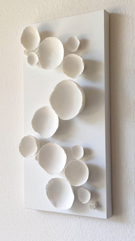 "One Wall Art panel,  White Paper mache  3D flowers: Paper Mache . White. Height Cm. 60. Width Cm. 30. Depth Cm. 9. nr 16 White flowers, different size .  Paper mache  3D Wall  Art panel, Wall Decoration, Paper mâché abstract composition, contemporary wall decor, Gift for home. A unique composition of handmade papier-mâché  flowers. Customized panels on request.   Instagram: alessandra.fabre http://ecoweddingdesign.blogspot.it https://www.facebook.com/EcoWeddingDesing (wish you click the \"like\ 3d Flowers Paper, Papier Mache Art Ideas, Paper Mache Home Decor, Beach Art Diy, Paper Mache Wall Art, Wall Art Panel, Mural 3d, Unique Composition, Paper Mache Art