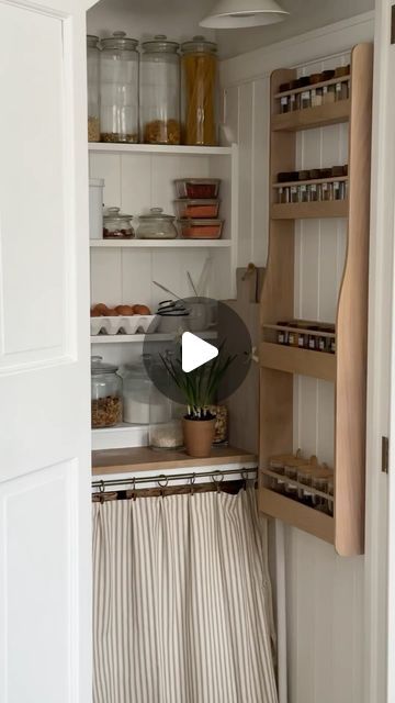 Catherine - Home & Garden Styling on Instagram: "T a k e  a  l o o k  i n s i d e . . . 

. . . my most useful kitchen cupboard! I do love a bit of organisation and surprisingly the rest of the family don’t mess it up too much 🤣 Hard to believe that the main shelving in the larder/pantry started life as a £10 bookcase from a local charity shop ( see previous reels for details ) 

It will come as no surprise that the urge to re-paint this storage cupboard is calling 🫣 better get a move on and finish up the snags on my other projects before embarking on the next!!

Details:
Oak spice rack @howdensjoinery 
Glass jars @ikea @neptunehomeofficial @homebargains 
Curtain rails @dunelmuk 

#cupboard #kitchencupboard #larder #pantry #pantryorganization #storagesolution #neptunehome #mydiymydecor # Larder Cupboard Ideas, Pantry Curtain, Larder Pantry, Garden Styling, Neptune Home, Larder Cupboard, Storage Cupboard, Curtain Rails, Kitchen Cupboard