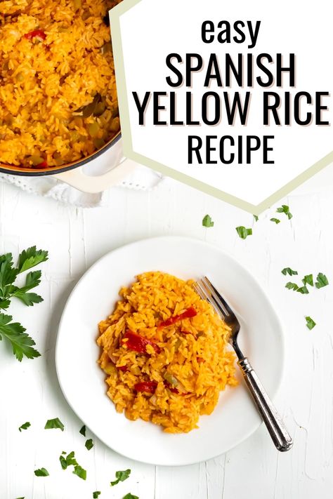 A white plate with arroz amarillo with a fork with it and a dutch oven of the arroz amarillo on the side with the words "easy spanish yellow rice recipe" in the foreground Yellow Rice With Peppers And Onions, Spanish Yellow Rice Recipe Puerto Rico, Diy Yellow Rice, Yellow Spanish Rice Recipe, Juan Pollo Rice Recipe, Goya Yellow Rice Recipe, Yellow Rice Recipe Spanish, Cuban Yellow Rice Recipe, Yellow Mexican Rice