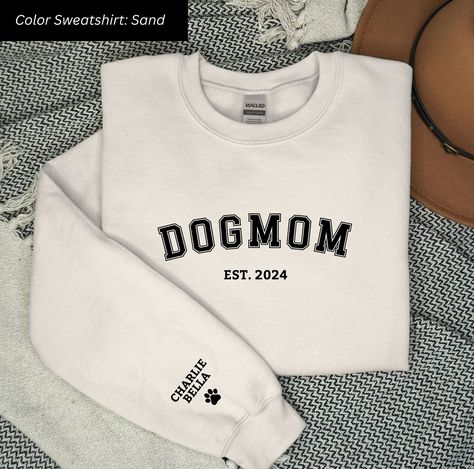 Elevate your dog mom style with our Personalized Dog Mom Sweatshirt! 🐾 Embrace the joy of motherhood by customizing the year you became a dog mom and proudly display your fur baby's name on the sleeve. Our cozy sweatshirt is a perfect blend of comfort and sentimentality, making it an ideal Dog Mom Gift. Dog Mom Apparel, Dog Mom Sweater, Embroidery Dog, Dog Mom Sweatshirt, Hand Embroidery Projects, Mom Sweatshirt, Dog Mom Gifts, Personalized Dog, Cozy Sweatshirts