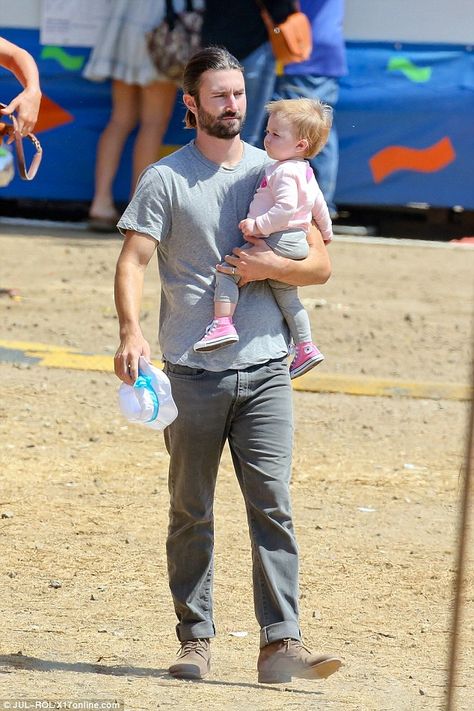 Family day out: Brandon Jenner and his wife Leah took it easy on Monday as the pair took their one-year-old daughter Eva to the Malibu Fair Brandon Jenner, Beverly Hills 90210 Brandon, Brandon Lake Concert, Dark Grey Jeans, Family Days Out, Take It Easy, Grey Jeans, One Year Old, Family Day