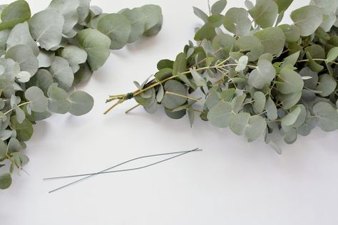 DIY Table Runner Using Eucalyptus Leaves | Hunker Diy Table Runner, Diy Eucalyptus, Eucalyptus Centerpiece, Leaves Diy, Table Runner Tutorial, Table Runner Diy, Candle Arrangements, Tall Candlesticks, Diy Table Decor