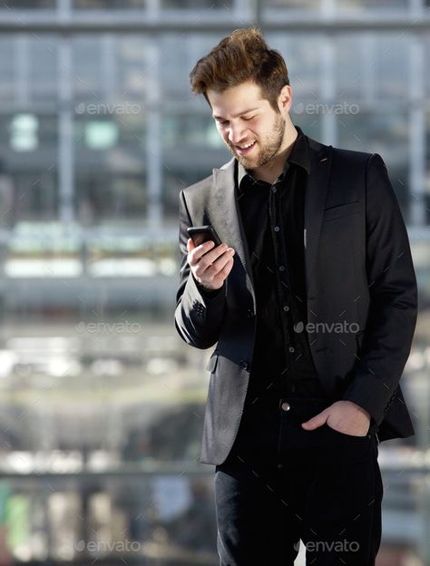 Handsome young man looking at mobile phone text message by mimagephotography. Portrait of a handsome young man looking at mobile phone text message#mobile, #phone, #man, #Handsome Photoshoot With Phone, Abba Videos, Phone Text Message, Diy Background, Men Fashion Photoshoot, Happy Guy, Best Mobile Phone, Business Portrait, People Photos