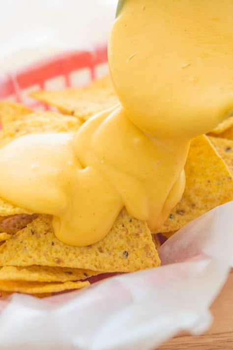 Nacho Cheese is easy to make yourself from scratch, and is the perfect melty sauce to pour over tortilla chips. This Nacho Cheese Sauce is made with only five all-natural ingredients, and takes 10 minutes to make. Chips Sauce, Homemade Nacho Cheese, Homemade Nacho Cheese Sauce, Nachos Cheese Recipe, Nacho Sauce, Tortilla Recipes, How To Make Cheese Sauce, Homemade Nachos, Homemade Tortilla