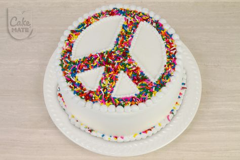 Hippie Peace Cake   Ingredients: 1 box of any Cake Mix  Ingredients called for on Cake Mix Box  6 ½ cups White Buttercream Icing  1 Pouch Cake Mate® Decorating Icing in White  1 Package Cake Mate® 8-pack Decorating Tips  1 2oz Bottle Cake Mate® Rainbow Sprinkles Hippie Cake Ideas, Peace Birthday Cake, Peace And Love Cake, Hippie Birthday Cake, Peace Cupcake Cake, Peace Sign Cake Ideas, Peace Sign Cookie Cake, Peace Sign Party, Peace Sign Cake