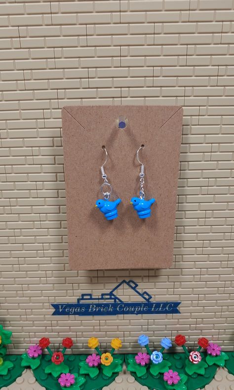 Custom Lego® Blue Bird dangling hook earrings with clear rubber backings. Perfect for Lego fans. These sterling silver plated, hypoallergenic earrings are handmade with new genuine Lego® pieces. Vegas Brick Couple LLC is not affiliated with LEGO®. This product is fan art and the LEGO logo, are registered trademarks of The LEGO Group, which does not authorize, sponsor or endorse this product. Lego Jewelry Holder, Lego Keychain Couple, Lego Heart Necklace Blue, Lego Stud Earrings, Lego Necklace, Lego Earrings, Lego Accessories, Lego Activities, Lego Pieces