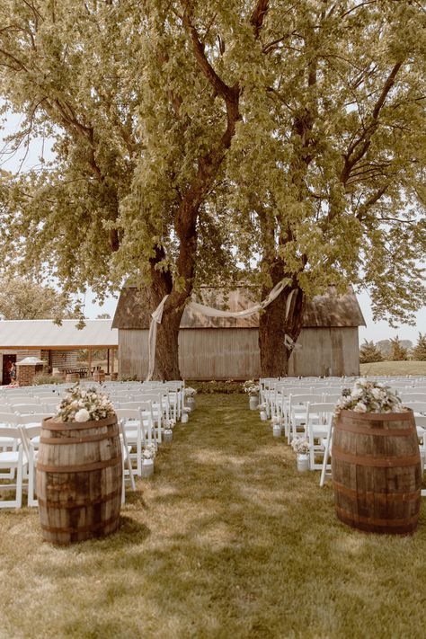 Whiskey barrel entrance with baby breath aisle decor Entrance To Tent Wedding, Wine Barrel Aisle Entrance, Whiskey Themed Wedding, Wine Barrel Alter Wedding, Ceremony Decorations Outdoor Aisle, Oak Barrel Wedding Decor, Paddock Wedding Ceremony, Down The Aisle Decor, Whiskey Barrel Wedding Decor