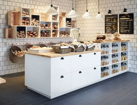 kitchen inspiration - A bakery with open wall shelves filled with newly baked bread and a bench with drawers and open shelves. Ikea Business, Bread Store, English Cake, Ikea Wall Shelves, Clothes Storage Systems, Cash Wrap, Retail Counter, Bakery Store, Ikea Wall