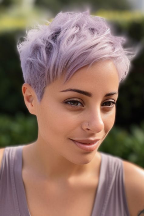 Embrace pastel shades by adorning your short pixie cut with delicate lavender hues. This hairstyle works wonders for all hair types and complements oval face shapes beautifully. Click here to check out more cute pixie haircuts trending for 2023. Pixie Haircut Purple, Lilac Pixie Cut, Lavender Hair Short, Lavender Pixie Hair, Lavender Short Hair, Short Lavender Hair, Pastel Pixie Hair, Lavender Pixie, Dyed Pixie Cut