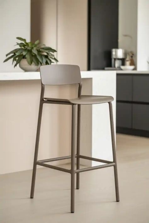 Modern bar stool with a beige seat and backrest in a minimalist kitchen setting. Island Seating, Saddle Stools, Stools For Kitchen Island, Bar Stools With Backs, Stool Height, Bar Height Stools, Island With Seating, Stools With Backs, Counter Height Bar