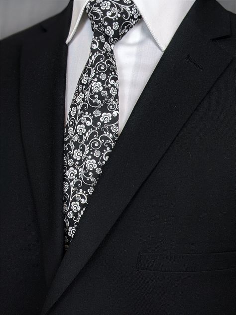 Elegant necktie for the big day. Makes the perfect gift for the father of the bride. Features a black background with white floral pattern. #White #Black #Necktie #Floral #Flower #Wedding Floral Wedding Tie, Winter Bridesmaid, Winter Bridesmaids, Winter Bridesmaid Dresses, Make A Tie, Floral Necktie, Flower Tie, Wedding Tie, Tie Pattern