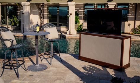 Cabinet Tronix Sunbrella outdoor weather proof lift cabinet hides & protects TV while increasing areas to watch TV. With this furniture having a 360 swivel & casters, spend more time outside by the pool, spa, deck, patio and sitting areas. https://www.cabinet-tronix.com/tv-lift-cabinets/sunbrella-outdoor-tv-lift-cabinet/  Great Falls Virginia T V Cabinets, Outdoor Hidden Tv, Outdoor Tv Lift Cabinet, Backyard Tv, Outdoor Tv Ideas, Outdoor Tv Stand, Tv Hidden, Tv Cabinet Ideas, Patio Tv