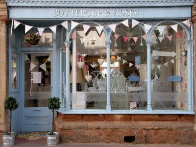 All it takes is a bit of bunting to make YOUR store front a cute store front Flower Shop Interiors, Outside Window, Store Front Windows, Cupcake Shop, Flower Shop Design, Cute Store, Font Shop, Flowers Shop, Shop Fronts