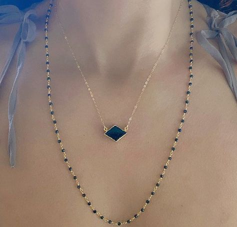 Gorgeous AAA Black Tourmaline Diamond Shape Necklace✨Black Tourmaline pendant is 24k gold plated just around the edges so you can soak in the crystal vibes. Chain is 18” and can be shortened to 17” and 16” lengths.Black Tourmaline will cleanse, purify, and transform dense energy into a lighter vibration. It is excellent for deflecting radiation energy as well. Black Tourmaline can also be used to both repel and protect against negativity. It enhances ones physical well being by providing an incr Nana Necklace, Black Tourmaline Necklace, Crystal Vibes, Gold Moon Necklace, Tourmaline Pendant, Stretch Band, Tourmaline Necklace, Necklace Black, Diamond Shaped