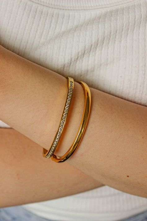 PRODUCT DESCRIPTION The trend of stacking jewellery isn't just having a moment, it is the moment. Confused about the stacking jewellery trend? Let us do the hard work for you. Your weekend arm candy is all sorted with our Vibes Bangles Stack Set. This sleek set of 2 is all you need for casual days to dressy nights out.They're each incredibly chic and absolutely perfect for any occasion comi...#of #of #StatementJewelry #Stack #of #Jewelry #Adornment #Art #the #Mastering #Accessories #The #the Gold Sleek Bangles, Simple Gold Bangle, Plain Gold Bangles, Jewelry Stack, Gold Bangles For Women, Gold Chain Design, Bangles Design, Indian Jewelry Sets, Bangles Jewelry Designs