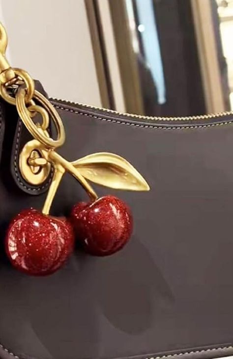 About this item
Dazzling Design: Elevate your accessory game with this sparkling cherry bag charm, boasting a vibrant glitter resin construction that's sure to catch eyes and compliments wherever you clip it.

Durability Meets Style: Crafted with quality materials, this charm is designed to withstand daily wear and tear, ensuring that your sparkling accessory remains a constant in your collection. Cherry Keychain, Cherry Bag, Red Keychain, Small Leather Bag, Beg Tangan, Small Gift Bags, Metal Accessories, Fashion Toys, Resin Pendant