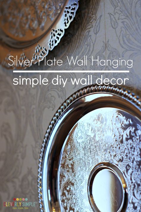 Grab a couple of silver plates for very cheap and make this seriously easy simple diy wall decor! It will dress up any wall. Silver Plates On Wall, Antique Wall Decor Living Room, Silver Platter Decor Ideas, Silver Plate Decor, Silver Wall Decor, Decorate On A Budget, Silver Plates, Simple Decorating, Haeger Pottery