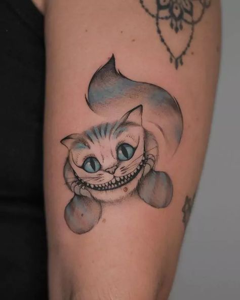 48 Stunning Cheshire Cat Tattoo Ideas You Must Try In 2024 Creepy Cheshire Cat Tattoo, Mad Hatter And Cheshire Cat Tattoos, Cat From Alice In Wonderland Tattoo, Cheshire Cat Tattoo Design, Crazy Cat Tattoo, Cheshire Cat Tattoos, Chester Cat Tattoo, Alice In Wonderland Tattoo Cheshire Cat, Alice In Wonderland Cat Tattoo