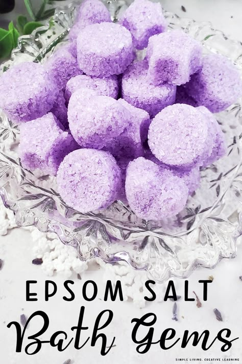 This gorgeous twist on the original bath salts, these adorable epsom salt bath gems are super easy to make and can be bundled up in a jar for gift giving. How To Make Bath Salts With Epsom Salt, Diy Lavender Bath Salts, Lavender Epsom Salt Bath Diy, Home Made Bath Salts Recipes, Epsom Salt Gift Ideas, Epson Salt Baths, Epson Salt Scrub Recipes, Homemade Epsom Salt Soak, Diy Bath And Body Products