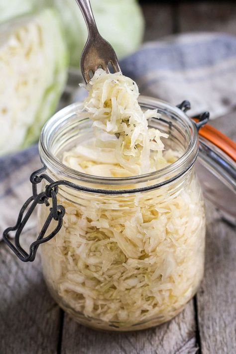 How to make Simple Cultured Cabbage!  Aka Sauerkraut- a delicious tangy addition to many dishes. Brimming with gut-healing probiotics, fermented cabbage is easy to make at home with just two ingredients! Making Sauerkraut, Homemade Sauerkraut, Healthy Probiotics, Fermented Cabbage, Sauerkraut Recipes, Fermentation Recipes, Vegetarian Cabbage, Probiotic Foods, Healthy Bacteria