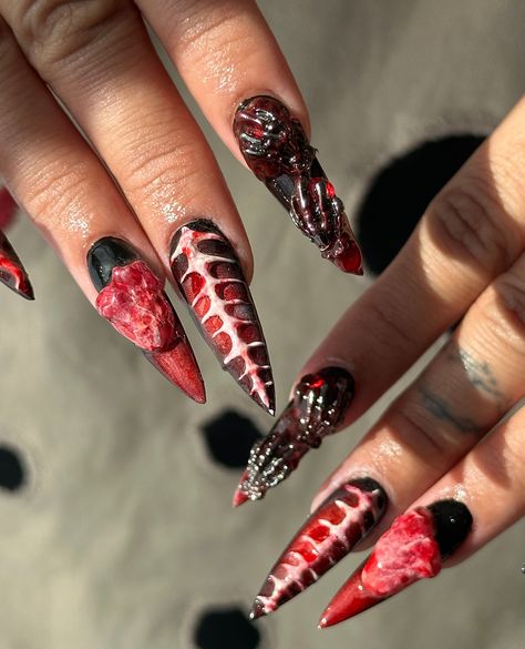 Check out these long stiletto shape nails featuring a jaw-dropping blood and bone design. Perfect for showing off your fierce and festive spirit this Halloween 💀✨ Scared? Come hold hands with us! Appointments available at 📍10 Piece Nails in New York City by Simon (IG: nails.by.simon) Stiletto Nail Shape, Halloween Inspired Nails, Ig Nails, Blood Nails, Stiletto Shaped Nails, Long Stiletto Nails, Shape Nails, Long Stiletto, Blood And Bone